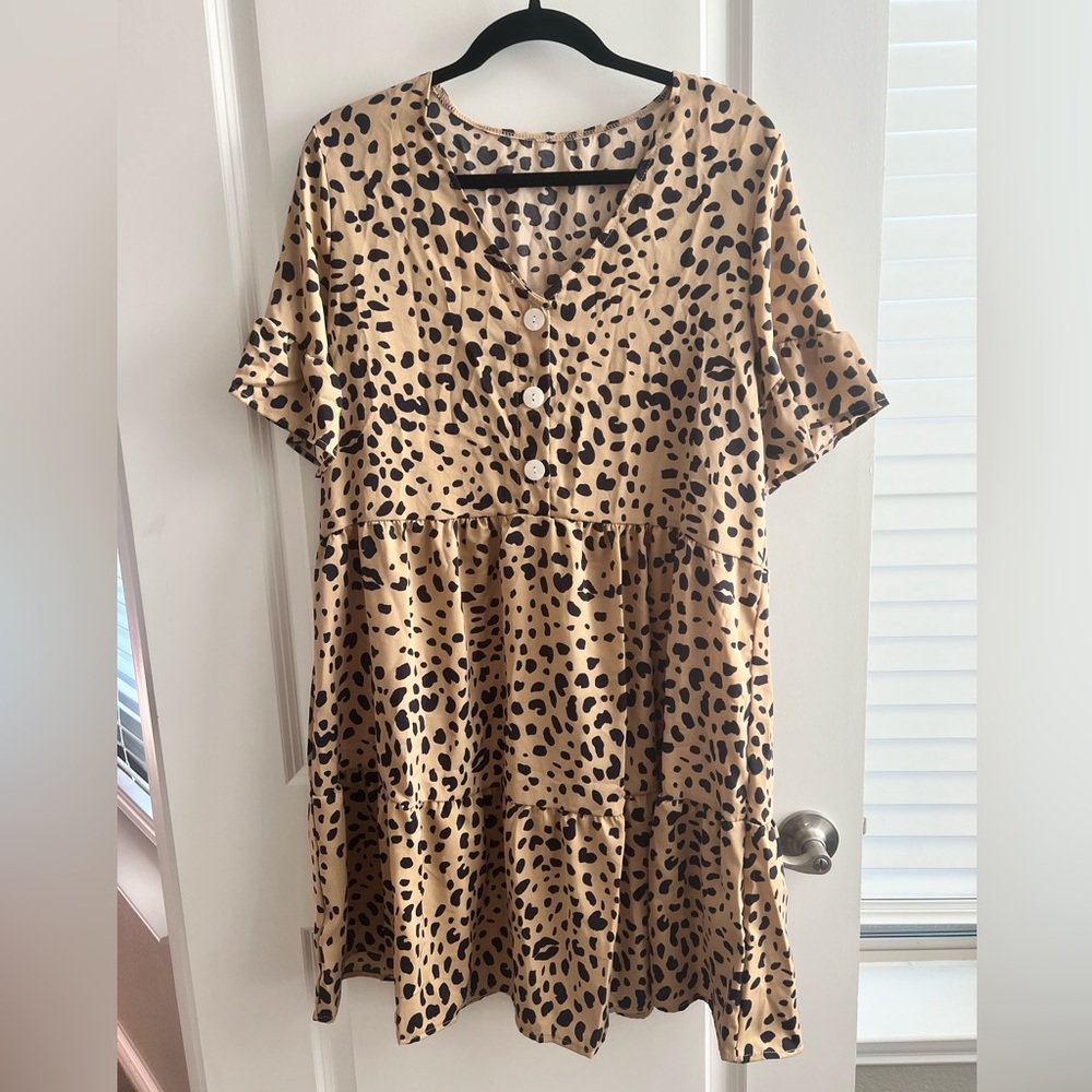 Leopard print dress with button detail. Brand new!